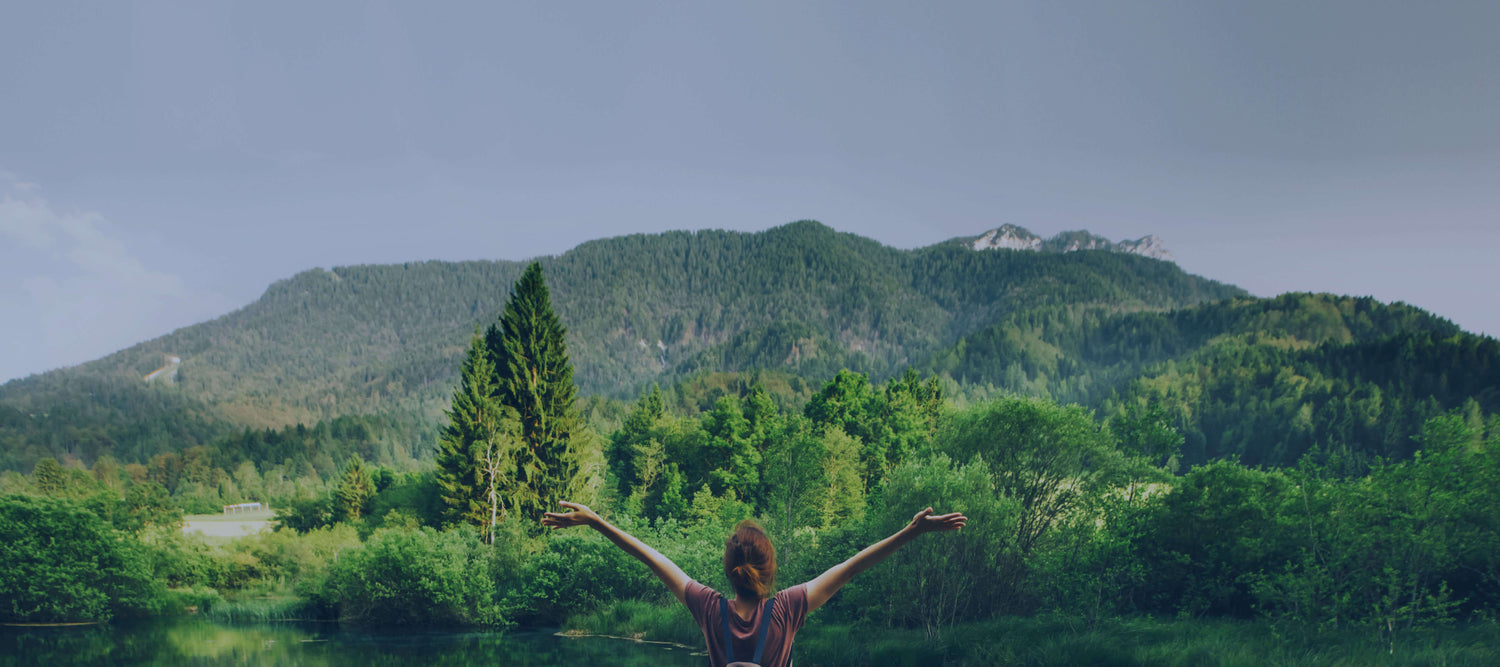 TEFL course graduate teaching abroad and looking out at lush mountainscapes