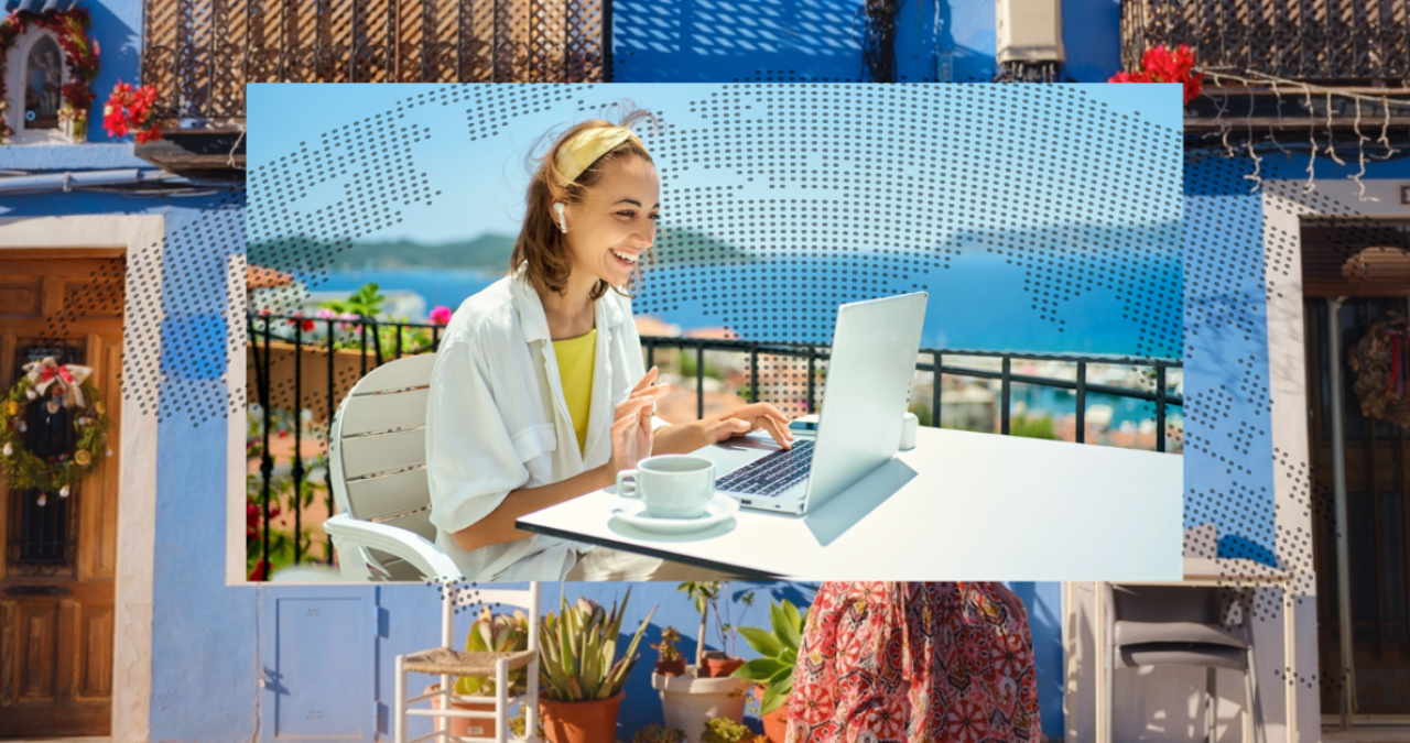 tefl grad teaching abroad on a laptop on a balcony with scenic view